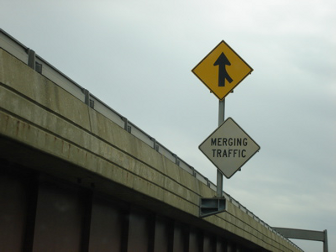 Merging Traffic Road Sign on a Highway Interchange