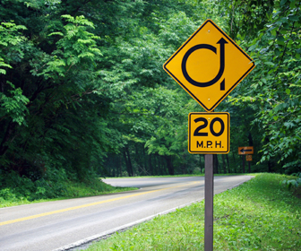 Slow down when going through a curve