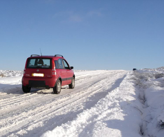 The vehicle traveling uphill has the right of way over the vehicle traveling downhill