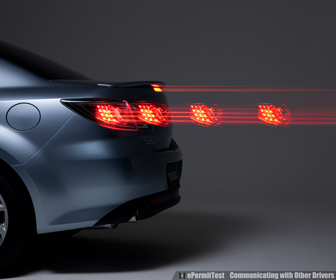 Tap your brakes a few times to let other drivers know that you're stopping